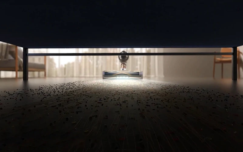 Aspiradora Honiture P7 Pro con luces LED iluminando y limpiando polvo en áreas oscuras.